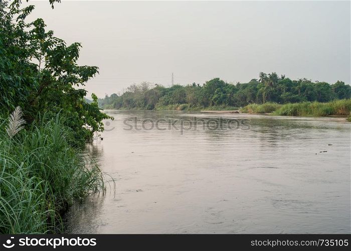 Morning time with river and grass landscape