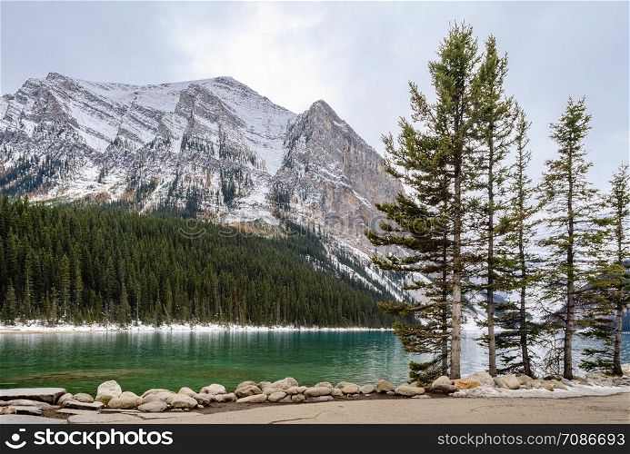 Morning view of Lake Louise with rock shore in Banff National Park, Alberta, Canada