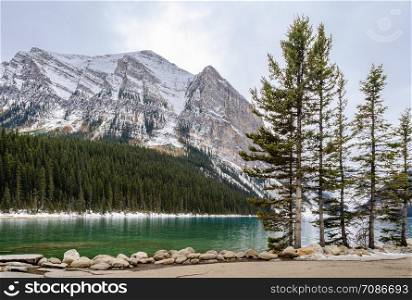 Morning view of Lake Louise with rock shore in Banff National Park, Alberta, Canada