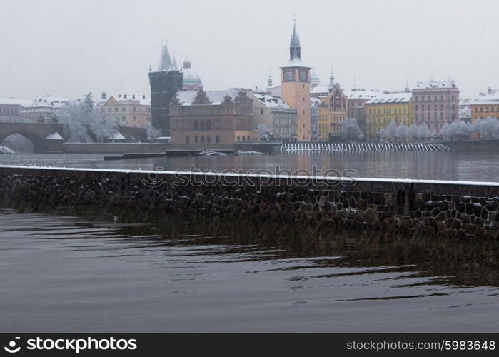 morning view on snow Charles bridge and Vltava in Prague