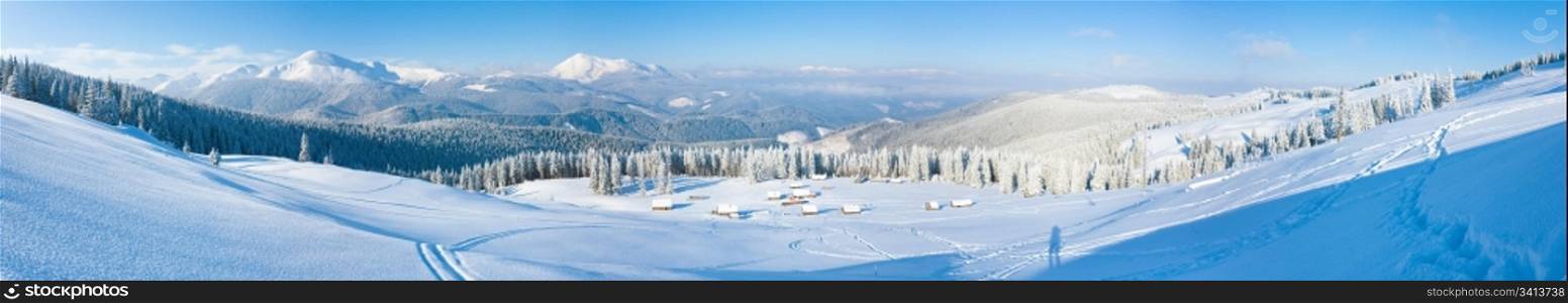 Morning winter calm mountain panorama with sheds group and mount ridge behind (Carpathian Mountains, Ukraine). Five shots stitch image.