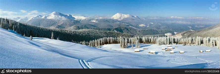Morning winter calm mountain panorama with sheds group and mount ridge behind (Carpathian Mountains, Ukraine).
