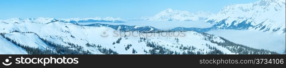 Morning winter mountain landscape with clouds in below valley (Hochkoenig region, Austria). All people are not identifiable.