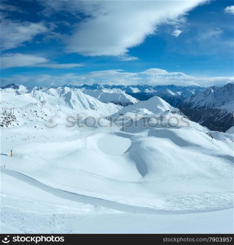 Morning winter Silvretta Alps landscape. Ski resort Silvrettaseilbahn AG Ischgl, Tirol, Austria. All people are unrecognizable.