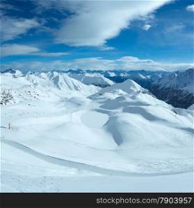 Morning winter Silvretta Alps landscape. Ski resort Silvrettaseilbahn AG Ischgl, Tirol, Austria. All people are unrecognizable.