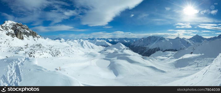 Morning winter Silvretta Alps landscape. Ski resort Silvrettaseilbahn AG Ischgl, Tirol, Austria. Panorama. All people are unrecognizable.