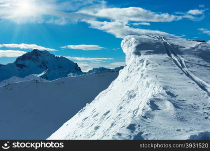 Morning winter Silvretta Alps landscape with sunshine in sky. Tyrol, Austria.