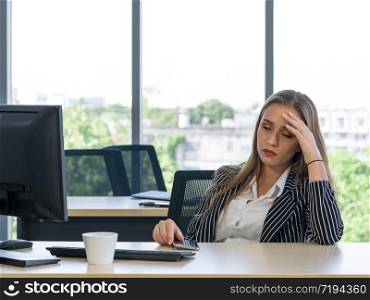 Morning work atmosphere In a modern office. Teen employees rest their eyes due to dizziness and headaches. After clearing the remaining pending work.