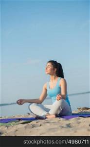 Morning Yoga Meditation at the Beach by woman