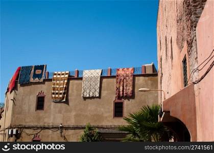 Moroccan building with newly produced Berber carpets in the Medina of Marrakech