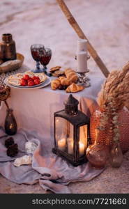 moroccan decor on the shores of a beautiful lake, candles and bungalows