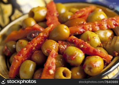 Moroccan hot harissa olives close up