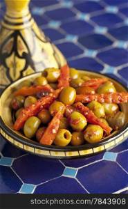 Moroccan hot harissa olives in a tagine