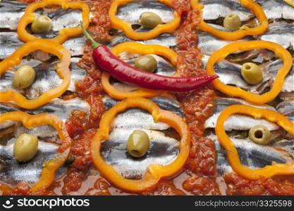 Moroccan sardine dish receipe with olives, bell peppers and chili pepper