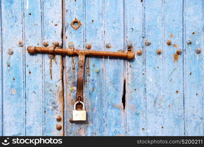 morocco in africa the old wood facade home and rusty safe padlock