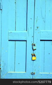 morocco in africa the old wood facade home and rusty safe padlock