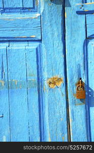 morocco in africa the old wood facade home and rusty safe padlock