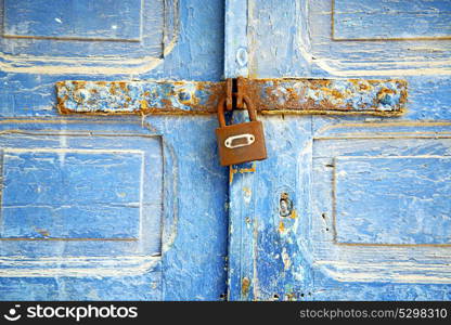 morocco in africa the old wood facade home and rusty safe padlock