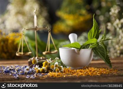 Mortar, Alternative medicine and Natural remedy. Natural medicine on wooden table background