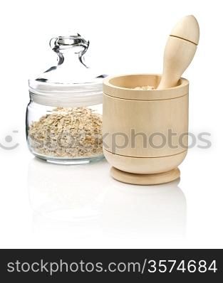 mortar and glass jar with cereals