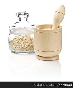 mortar and glass jar with cereals