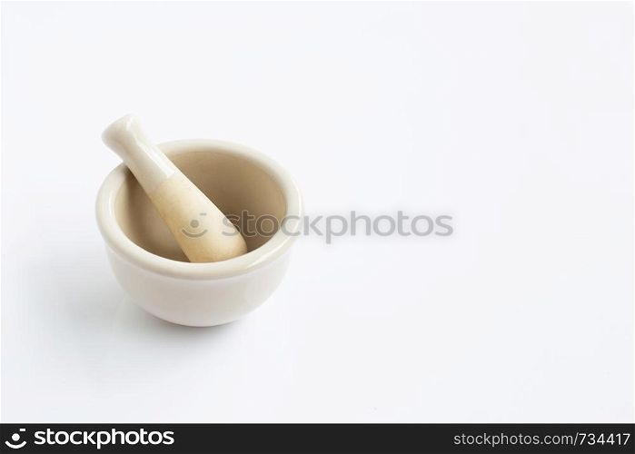 Mortar and pestle on white background.