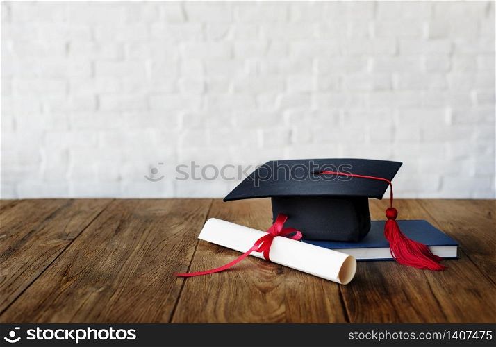 Mortar board and a graduation diploma