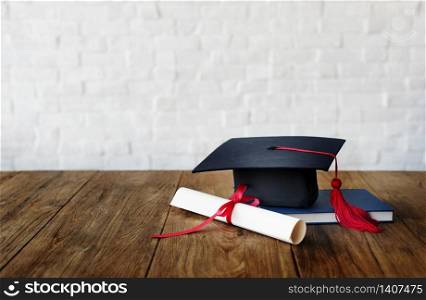 Mortar board and a graduation diploma