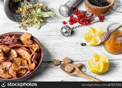 Mortar,linden,dried apples and lemon as medicinal ingredients