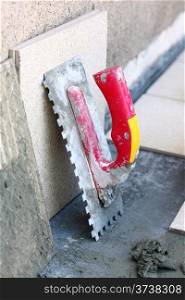 mortar on wall construction notched trowel work tools