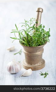 mortar with fresh herbs and spices