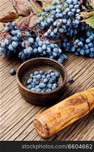 Mortar with healing berries in herbal medicine.Health diet.Herbalism.Herbalist. Berries in herbal medicine