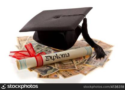 mortarboard and yen. symbolic photo for education costs in japan.