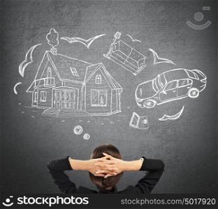 Mortgage and credit concept. Young woman planning her future