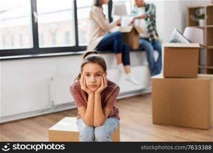 mortgage, family and real estate concept - sad girl moving to new home with mother and father packing things. sad girl moving to new home with her family