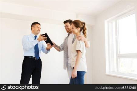 mortgage, people and real estate concept - happy couple and realtor with tablet pc computer at new home. couple and realtor with tablet pc at new home