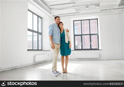 mortgage, people and real estate concept - happy couple at new home. happy couple at new home