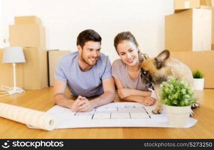 mortgage, people and real estate concept - happy couple with boxes, blueprint and dog moving to new home. couple with boxes, blueprint and dog at new home