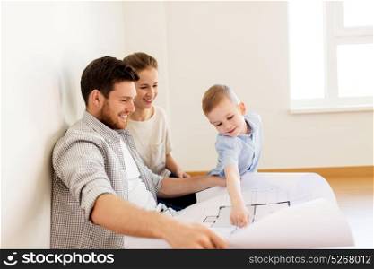 mortgage, people, housing and real estate concept - happy family with blueprint or house project moving to new home. happy family with blueprint moving to new home