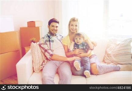 mortgage, people, housing and real estate concept - happy family with boxes moving to new home