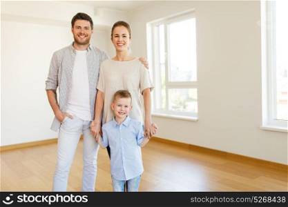 mortgage, people, housing and real estate concept - happy family with child moving to new home. happy family with child moving to new home