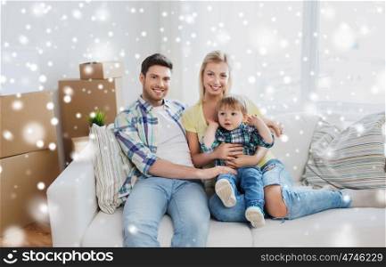 mortgage, people, housing, moving and real estate concept - happy family with little son at home over snow