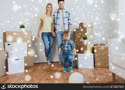 mortgage, people, housing, moving and real estate concept - happy family with boxes playing ball at new home over snow