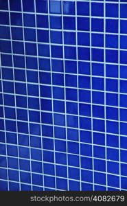 Mosaic tile wall in close up, blue, square tiles