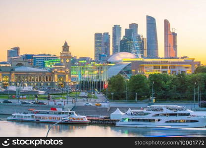 Moscow City skyline business district and Moscow River in Russia at sunset