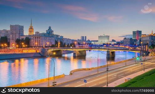 Moscow City skyline business district and Moscow River in Russia at sunset