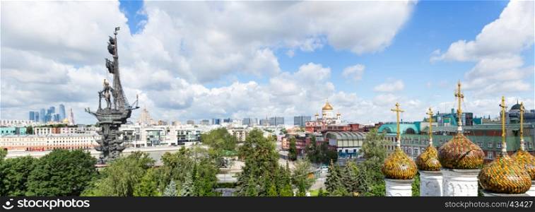 Moscow, Russia - July 09, 2016: Panorama of Moscow downtown - International Business Center, Peter the Great Statue on the Moscow river (the eighth tallest statue in the world), Ministry of Foreign Affairs, ?athedral of Christ the Saviour, old confectionery and domes of an Orthodox church of Saint Nicholas at the foreground, all symbols of power and success - at the sunny summer day. View from above (Moscow, Russia)