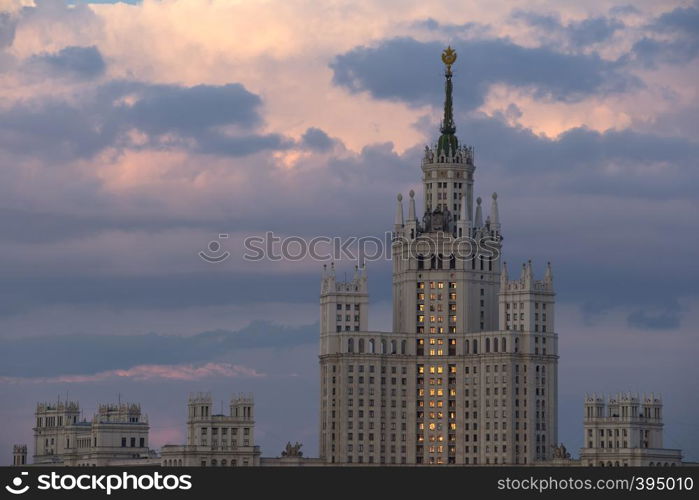 Moscow Russia on against dramatic sunset sky. Building of Stalin's era.