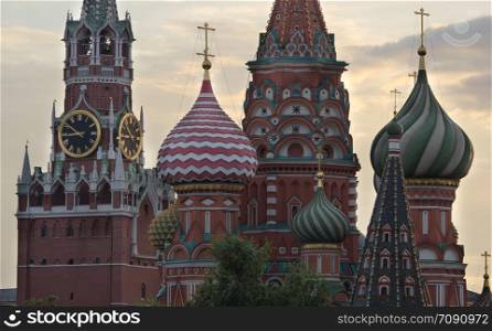 Moscow Russia View on Kremlin Towers and St Basil Cathedral, on against cloudy sky.