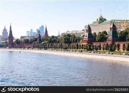 Moscow skyline - view of The Kremlin embankment, Kremlin buildings, walls, towers, Moscow City in summer afternoon